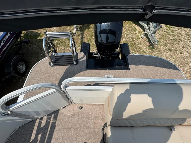Slide: The Image of 2020 Ranger Reata 223C boat deck with seating and motor, viewed from above. - 11