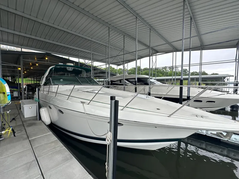 Slide: The Image of 2000 Formula 40 PC yacht docked in a covered marina. - 11