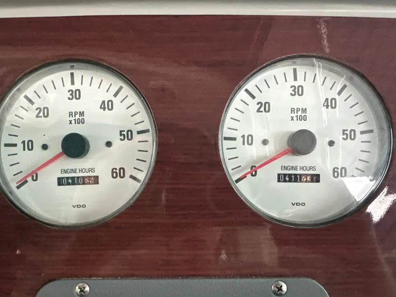 Slide: The Image of Dashboard gauges of a 2000 Formula 40 PC boat showing RPM and engine hours. - 17