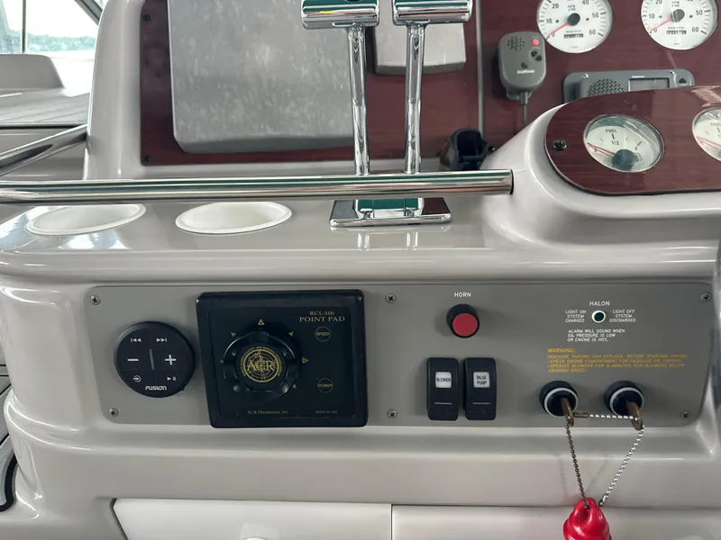 Slide: The Image of Control panel of a 2000 Formula 40 PC boat with gauges and switches. - 19