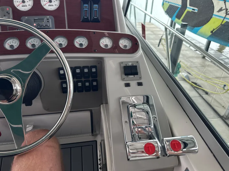 Slide: The Image of Control panel of a 2000 Formula 40 PC boat with steering wheel and gauges. - 21