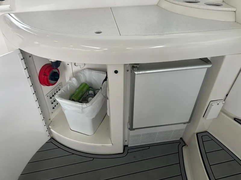 Slide: The Image of 2000 Formula 40 PC yacht interior with mini fridge and storage compartment. - 24