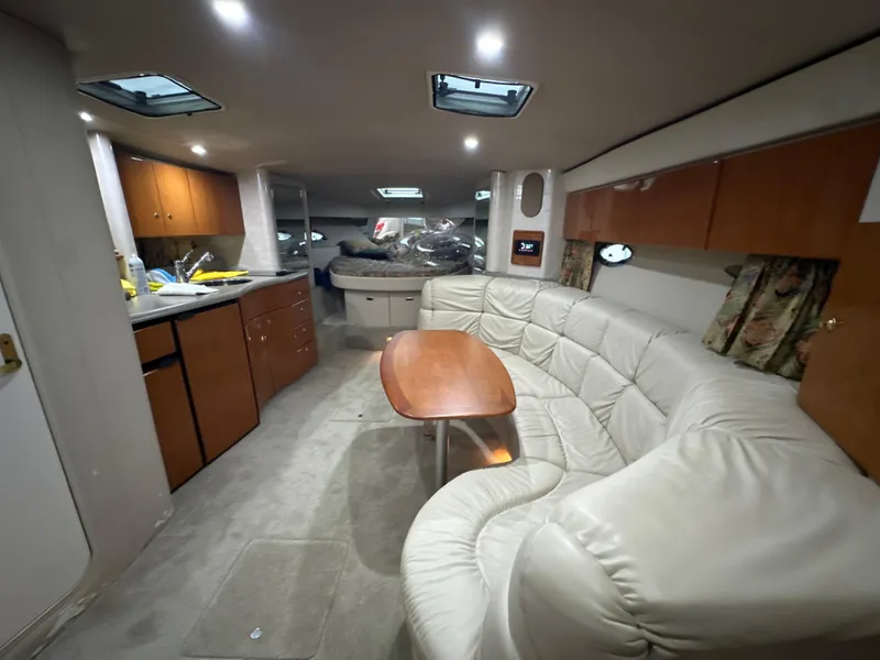 Slide: The Image of Interior of 2000 Formula 40 PC yacht with leather seating and wooden cabinetry. - 27