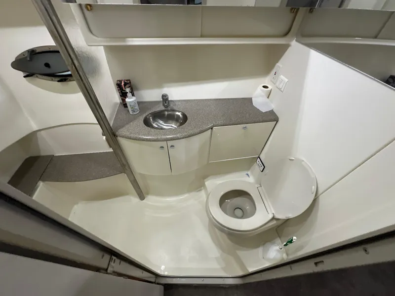 Slide: The Image of Bathroom interior of a 2000 Formula 40 PC yacht, featuring sink and toilet. - 31