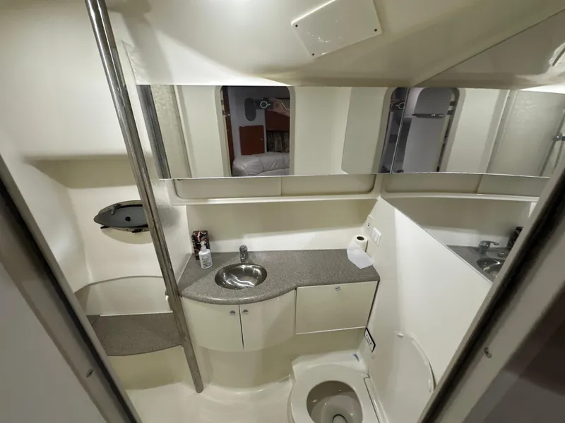 Slide: The Image of Bathroom interior of 2000 Formula 40 PC yacht with sink, toilet, and mirror. - 32