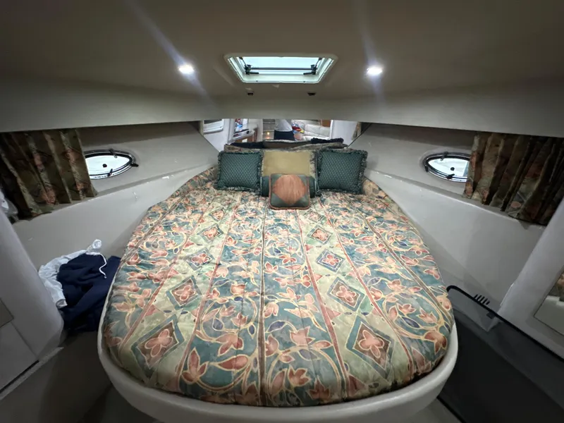 Slide: The Image of Cozy cabin interior of 2000 Formula 40 PC yacht with floral bedding and porthole windows. - 38
