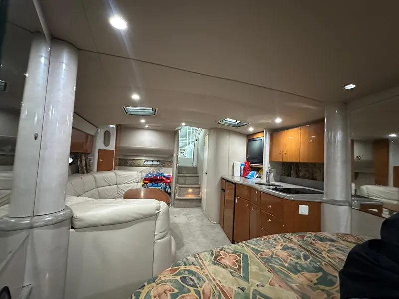 Slide: The Image of Interior of a 2000 Formula 40 PC yacht with modern amenities and comfortable seating. - 45