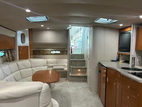 Slide: The Image of Interior of 2000 Formula 40 PC yacht with white leather seating and wooden cabinetry. - 46