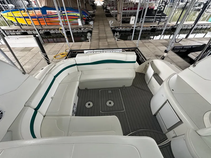 Slide: The Image of Spacious seating area on a 2000 Formula 40 PC yacht docked at a marina. - 47