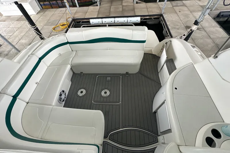 Slide: The Image of 2000 Formula 40 PC boat interior with white seating and gray flooring. - 53