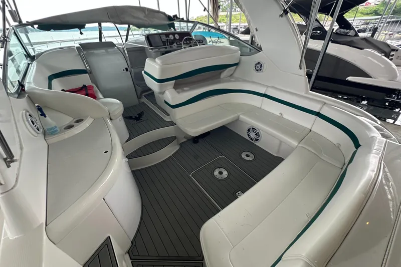 Slide: The Image of 2000 Formula 40 PC boat interior with white seating and modern dashboard. - 55
