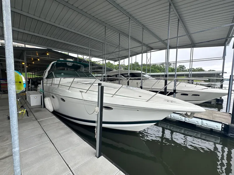 Slide: The Image of 2000 Formula 40 PC yacht docked in a covered marina. - 9