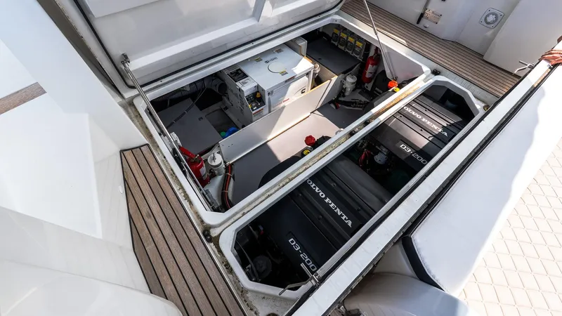 Slide: The Image of Engine compartment of 2018 Jeanneau NC11 boat with Volvo Penta engines and equipment. - 5