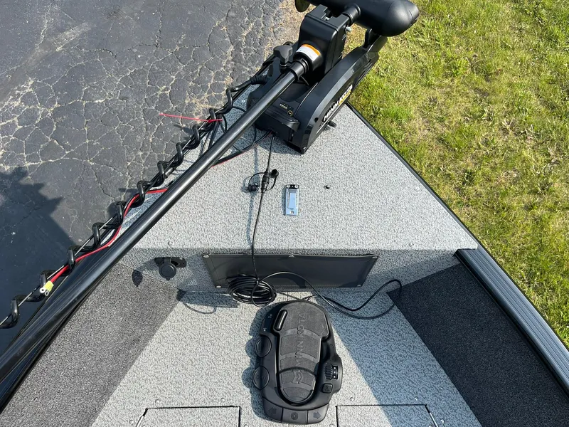 Slide: The Image of 2026 Lund 1650 Rebel XL SS boat deck with trolling motor and control panel. - 18