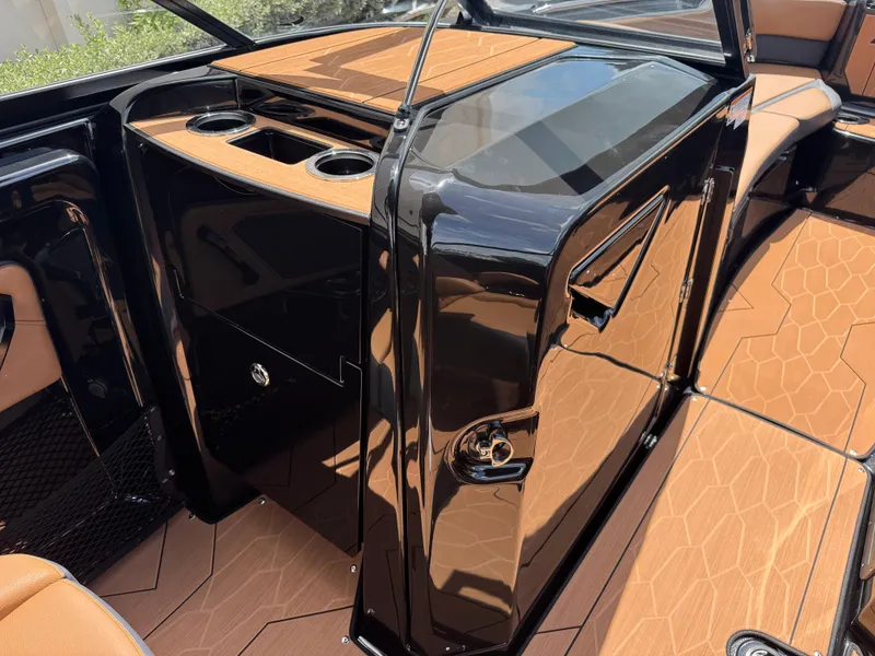 Slide: The Image of 2025 Yamaha Boats 255XD interior with sleek black finish and modern design elements. - 18