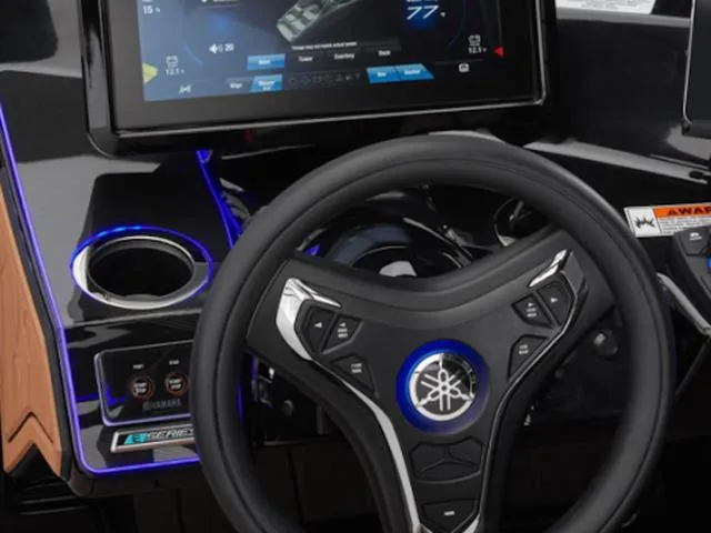 Slide: The Image of 2025 Yamaha Boats 255XD dashboard with steering wheel and digital display. - 43