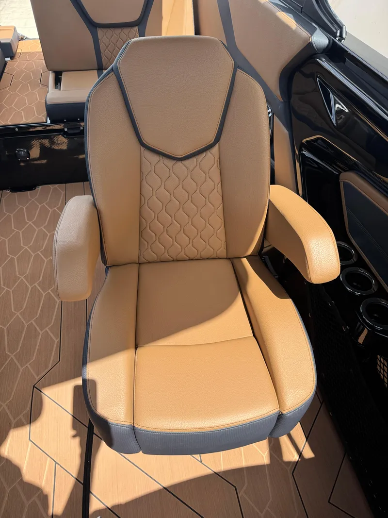 Slide: The Image of Luxury seating on 2025 Yamaha Boats 255XD, featuring tan upholstery and modern design. - 20