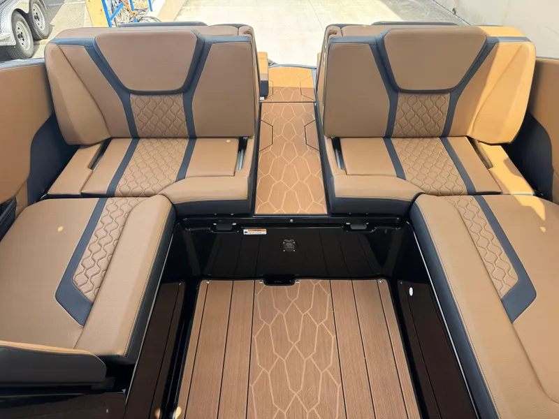 Slide: The Image of Luxurious interior seating of 2025 Yamaha Boats 255XD with tan and black upholstery. - 22