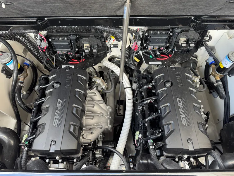 Slide: The Image of Engine compartment of 2025 Yamaha Boats 255XD, featuring dual SVHO engines. - 33
