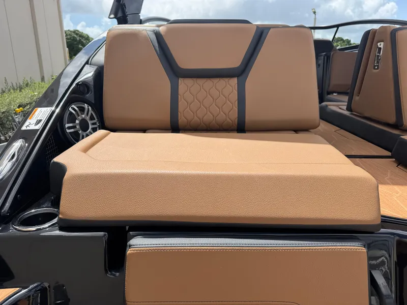 Slide: The Image of 2025 Yamaha Boats 255XD interior seating with tan upholstery and modern design. - 5