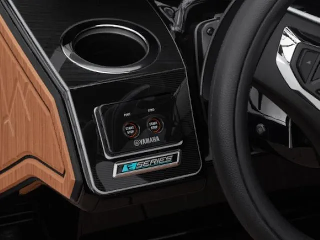 Slide: The Image of 2025 Yamaha Boats 255XD dashboard with E-Series controls and cup holder. - 8