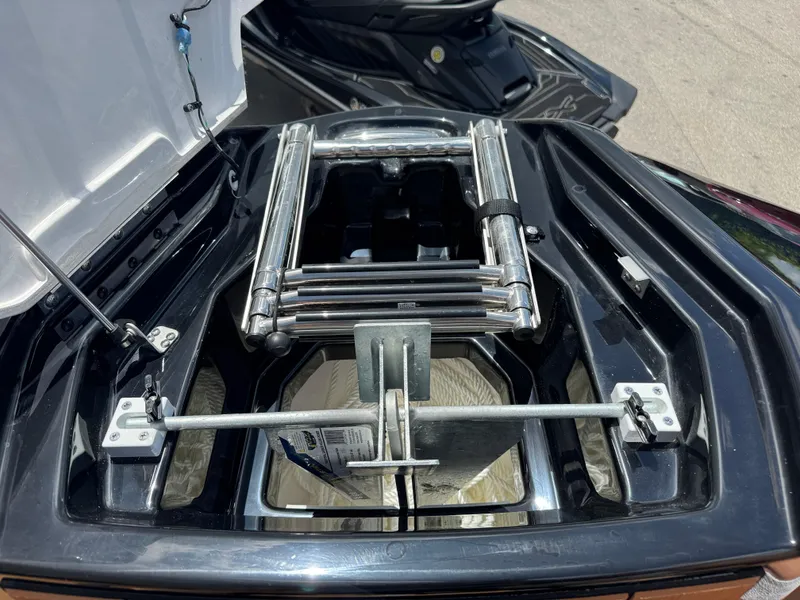 Slide: The Image of 2025 Yamaha Boats 255XD ladder compartment, showcasing sleek design and functionality. - 15