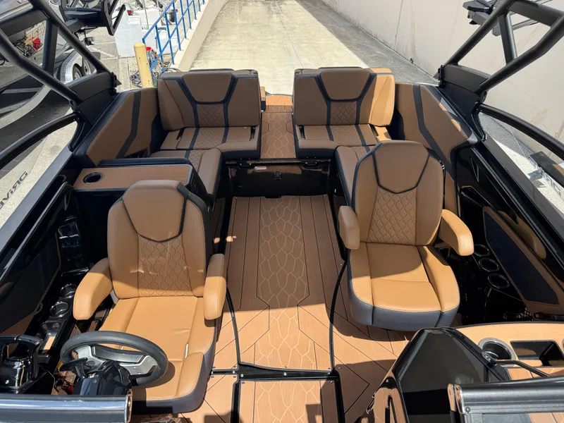 Slide: The Image of 2025 Yamaha Boats 255XD interior with luxurious tan seating and modern design. - 17