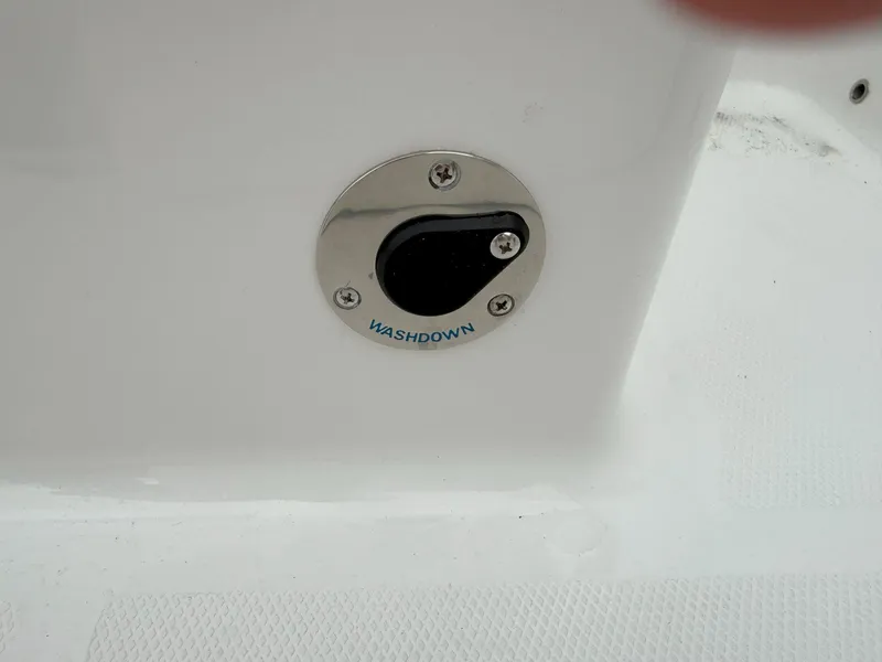 Slide: The Image of Washdown outlet on 2026 Blackfin 232 DC boat, featuring a sleek stainless steel design. - 10