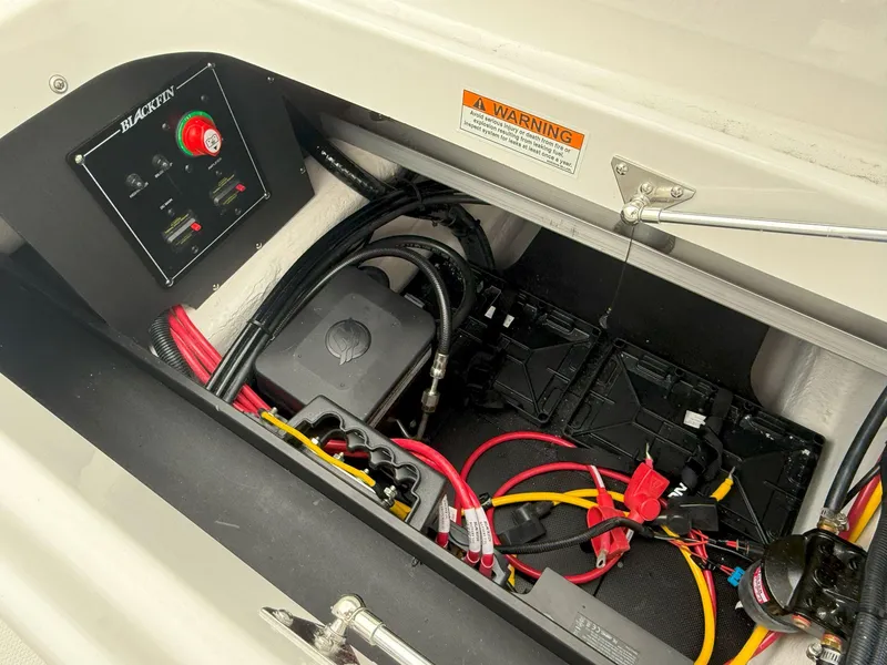 Slide: The Image of Electrical compartment of a 2026 Blackfin 232 DC boat with wiring and battery setup. - 20