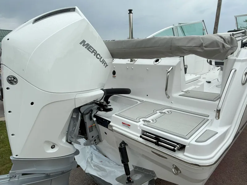 Slide: The Image of 2026 Blackfin 232 DC boat with Mercury engine, showcasing sleek design and modern features. - 7