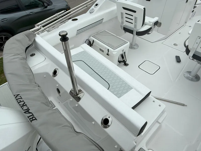 Slide: The Image of 2026 Blackfin 232 DC boat interior with seating and storage features. - 8