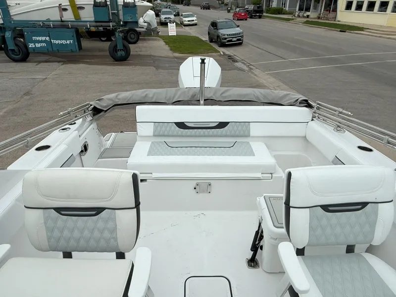 Slide: The Image of 2026 Blackfin 232 DC boat interior with white seating and modern design. - 9