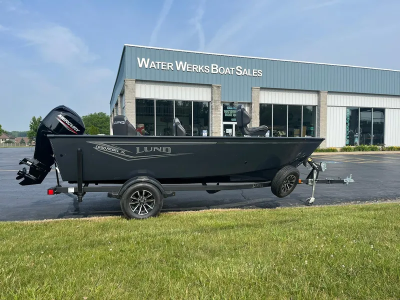 Slide: The Image of 2026 Lund 1650 Rebel XL Tiller boat on trailer at Water Werks Boat Sales. - 1