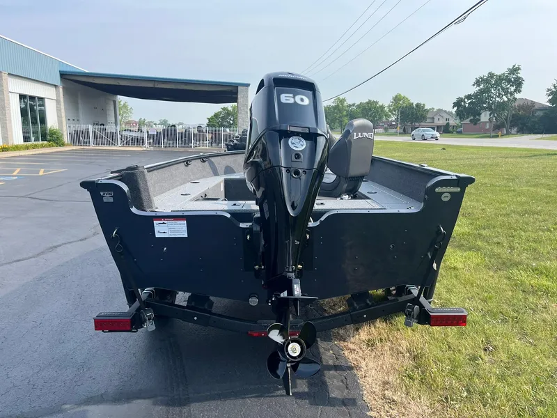 Slide: The Image of 2026 Lund 1650 Rebel XL Tiller boat with 60 HP motor on trailer. - 3