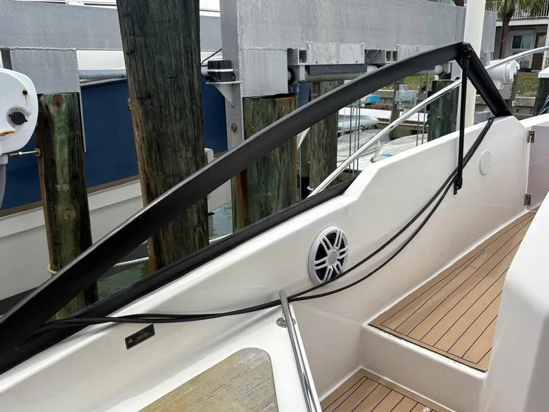 Slide: The Image of 2023 Hanover 377 boat deck with wooden flooring and sleek railing design. - 10