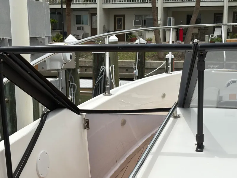 Slide: The Image of 2023 Hanover 377 boat docked, featuring sleek design and modern railing. - 12