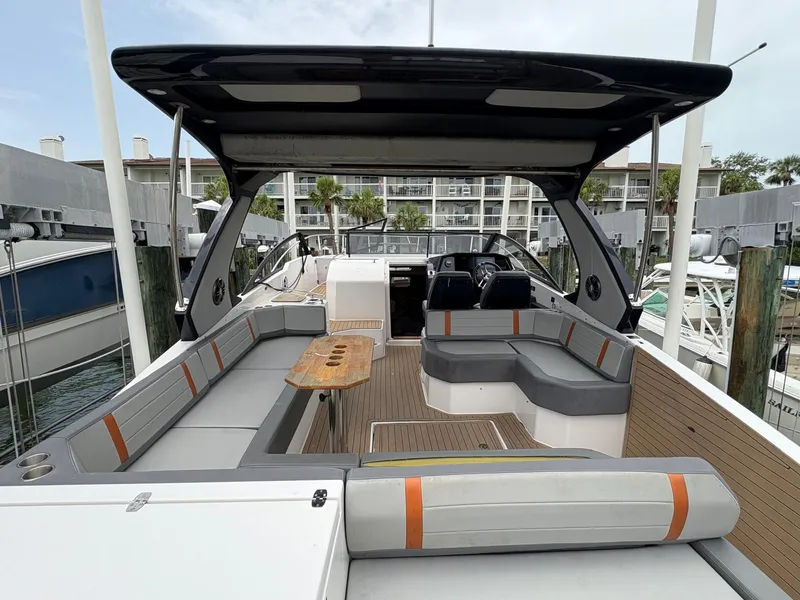 Slide: The Image of Luxurious 2023 Hanover 377 boat with spacious seating and sleek design at a marina. - 13