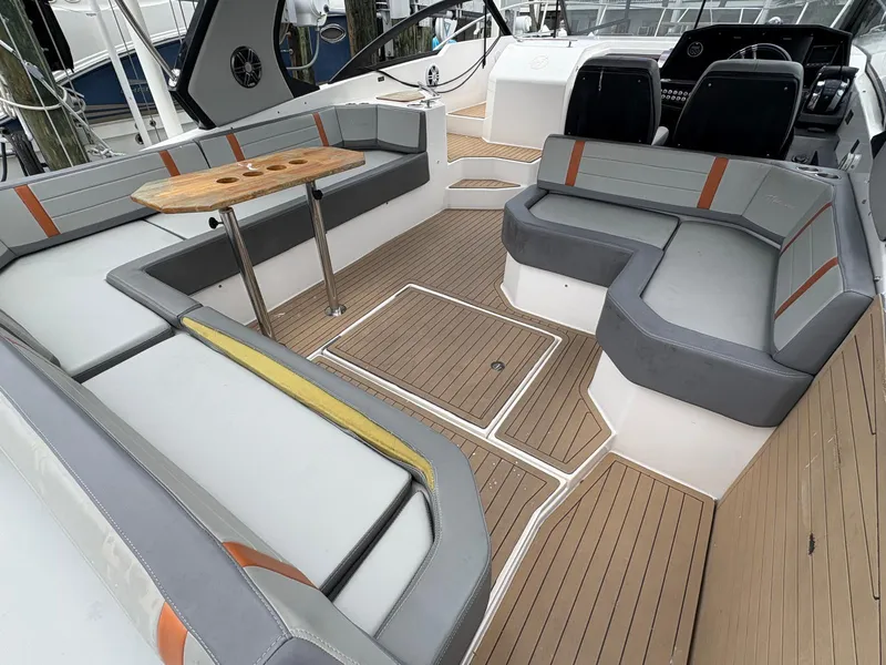 Slide: The Image of Spacious seating area on 2023 Hanover 377 boat with modern design and wooden accents. - 14