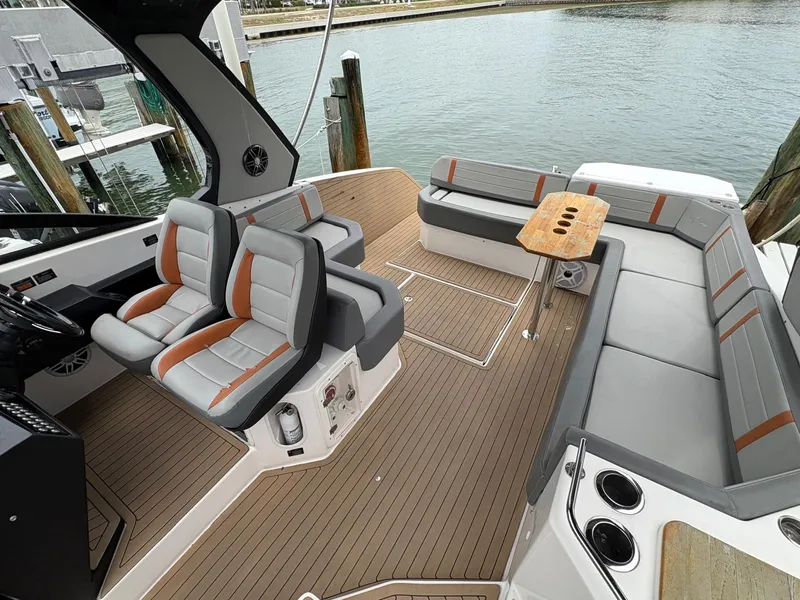 Slide: The Image of Luxurious 2023 Hanover 377 boat interior with modern seating and wooden deck. - 16