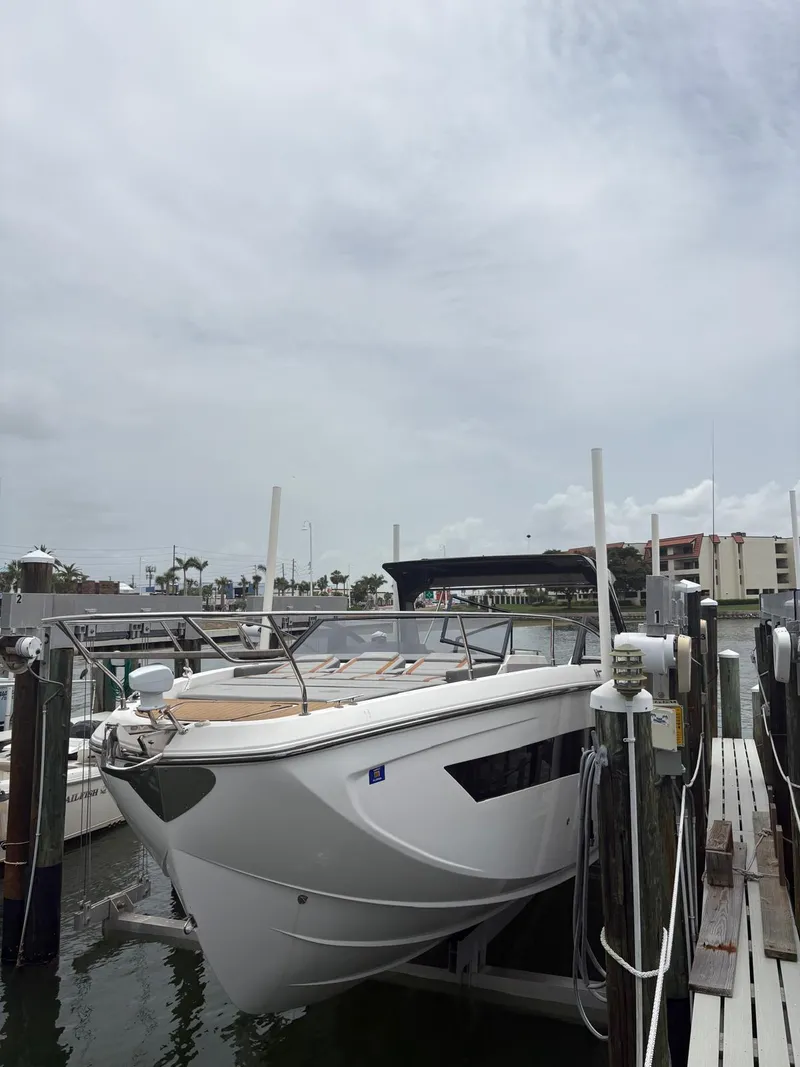 Slide: The Image of 2023 Hanover 377 boat docked at marina under cloudy sky. - 20