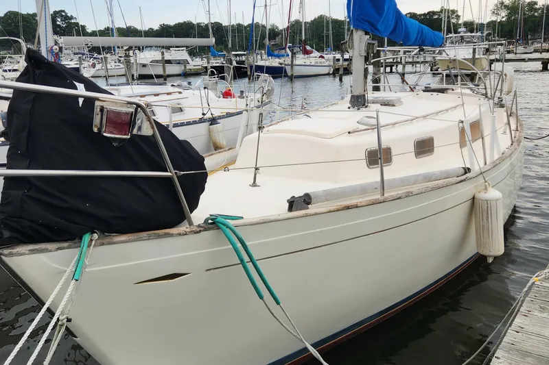 Slide: The Image of 1974 Hallberg-Rassy Rasmus 35 sailboat docked in a marina. - 4
