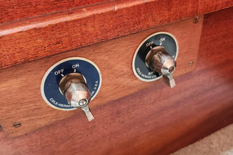 Slide: The Image of Switches on a 1974 Hallberg-Rassy Rasmus 35 boat, featuring Cole Hersee Co. components. - 43