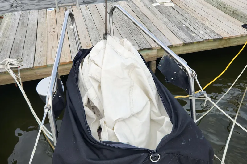 Slide: The Image of Sail stored on Hallberg-Rassy Rasmus 35, 1974, docked by wooden pier. - 6