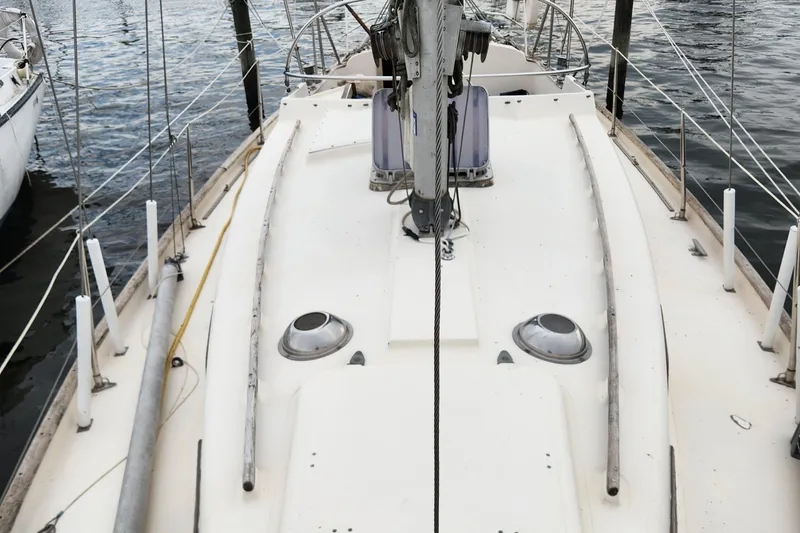 Slide: The Image of 1974 Hallberg-Rassy Rasmus 35 sailboat deck view with mast and fittings. - 7