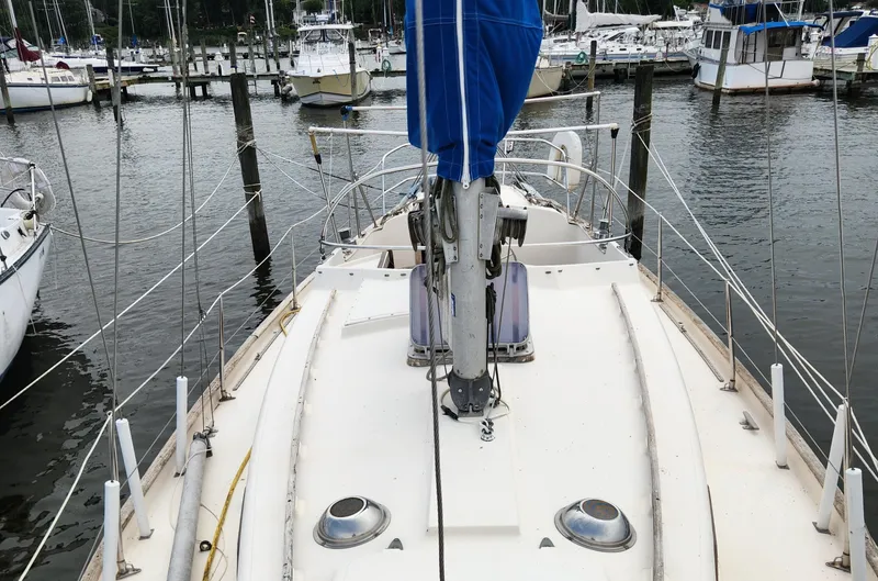 Slide: The Image of 1974 Hallberg-Rassy Rasmus 35 sailboat docked at a marina, view from the deck. - 8