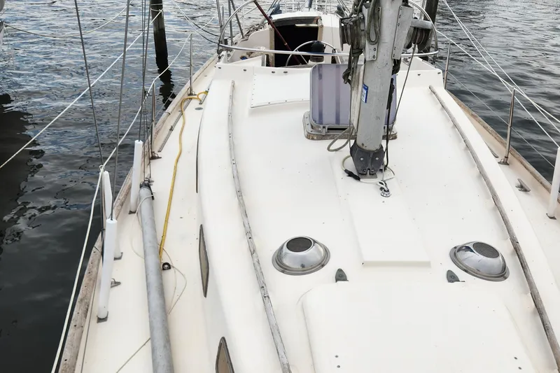 Slide: The Image of 1974 Hallberg-Rassy Rasmus 35 sailboat deck with mast and fittings. - 9