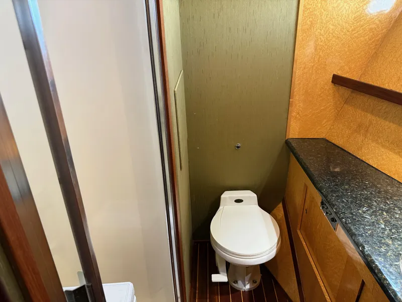 Slide: The Image of Bathroom interior of 1990 Hatteras 45 Convertible yacht with modern fixtures. - 19