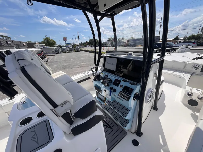 Slide: The Image of 2023 Tidewater 2700 Carolina Bay boat interior with modern helm and seating. - 8
