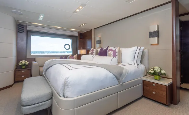 Slide: The Image of Luxurious bedroom interior of 2019 Princess Y88 Motor Yacht with elegant decor and large window view. - 12