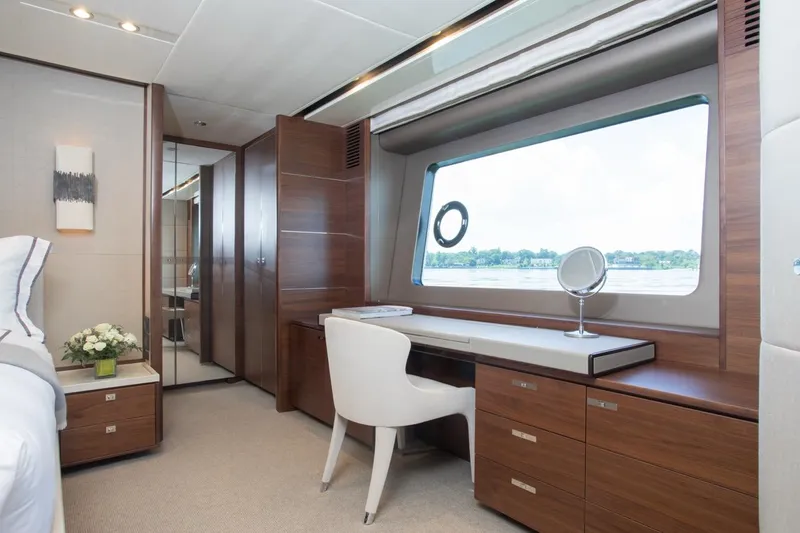 Slide: The Image of Luxurious interior of 2019 Princess Y88 Motor Yacht with elegant wood furnishings and large window view. - 14